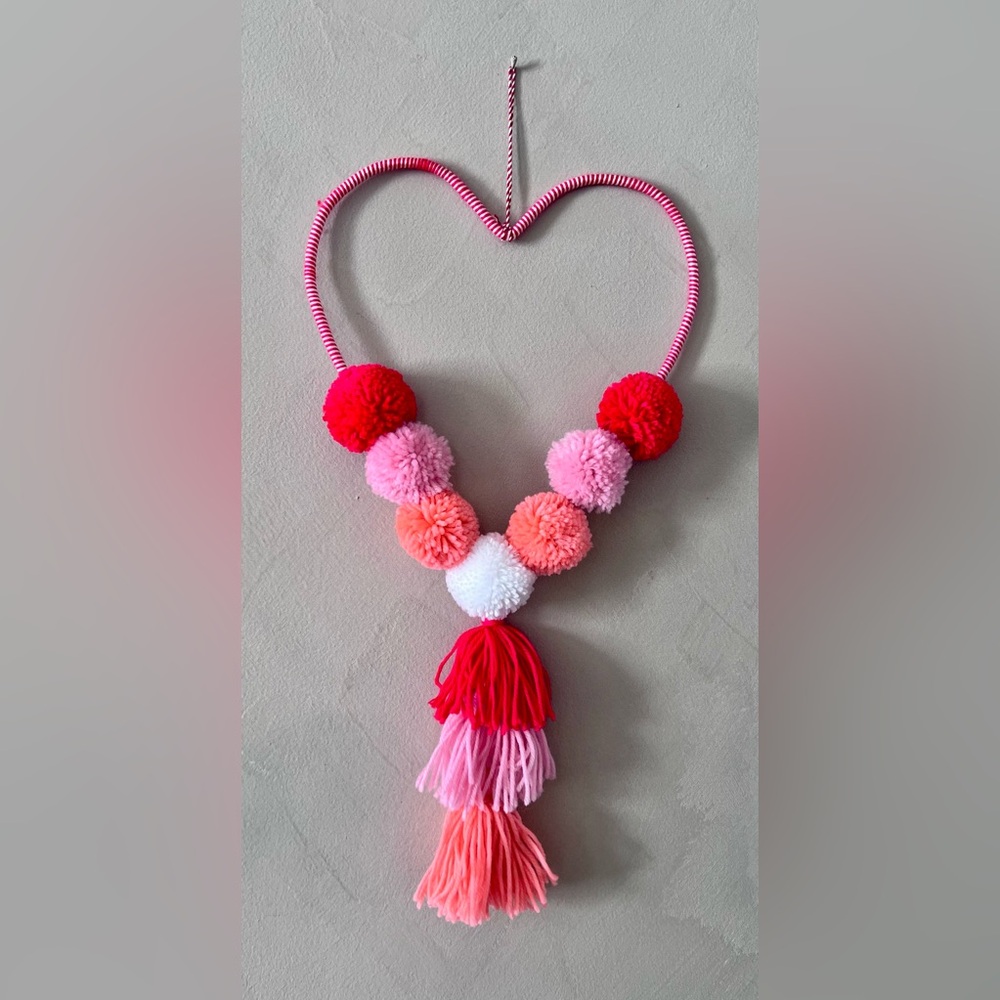 Heart shaped wall hanging. Approx. 19” tall x 10” wide at its widest point.